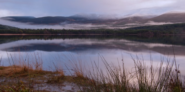 Apologies rather busy just now and not getting out and about so have been delving in to the archives and this appeared.I was drawn to the sun attempting to break through the thick cloud over the Cairngorm's - with limited effect. 