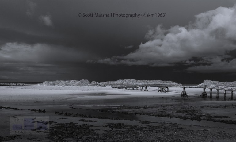 The footbridge at Lossiemouth leading across the the estuary to the spit of beach which leads along golden sands the seven miles to the neck of the Spey river famous throughout the world for salmon fishing.