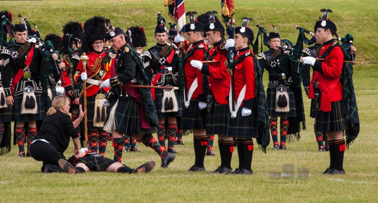 Although it is rare that I publish people images - never the less I enjoy candid and naturally lit people images (I dont think you will find me in a studio - but never say never). To broaden my experience and challenge myself in an area which is not my comfort zone. I entered "Man Down" in to my Camera Club projected image - people category. The judge  offered the following comments "and we can see straight away what is going - or at least we think we can - definitely one for the wall good exposure sharp throughout neutral background - well seen  and awarded the image 17/20. Which as a duck out of water I was well pleased with. This is a parade on a warm day (my son is the concerned member of the colour party extreme right) The Pipeband is observing in the background and the colour party has been turned - in to line to march off in column of route however one of his colleagues has conked out - the nurse is attempting to administer first aid and the Colour Sergeant Major has seen it all before. 